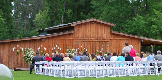 An outdoor wedding ceremony at The Barn
